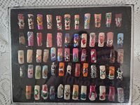 front view of entire boxed display showing all painted nails