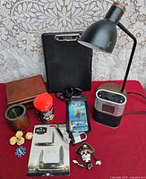 Full lot overview showing lamp, clipboard, knives, clock, box and misc