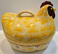 Side angle of ceramic hen-on-nest casserole
