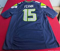 Back view showing player name FLYNN and number 15