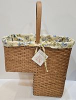 Full view of Basketville stair basket showing shape, handle, and liner