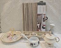 Overall lot showing teapot, table runner, napkin rings, dish, ladle, figurine