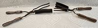 Both manual curling irons side by side showing overall condition and design