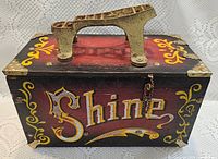Front view showing Shine lettering, footrest, chain and corner brackets