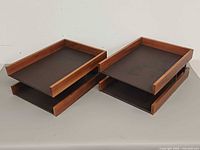 Pair of two-tier wooden desk paper trays side by side