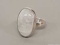 Front view showing oval moonstone and bezel setting