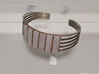 Front view of cuff showing mother of pearl inlay panels