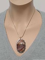 Pendant necklace on mannequin showing scale