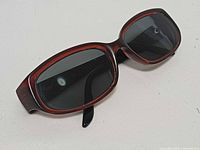 Three-quarter view of sunglasses showing front and lenses
