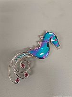 Front view of Swarovski seahorse brooch