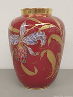 Front view showing orchid motif and gold detailing