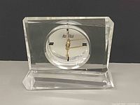 Front view of Jean Claude lucite mantel clock