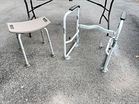 Shower stool and safety frame full view on pavement