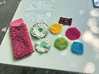 Group shot of towel and all handmade scrubbies on table
