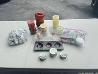 Group shot of all candles, tealights, holders and accessories on table