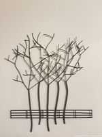 Full view of metal branch wall art on wall