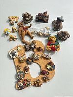 All items grouped showing board, pins, loose figures, plush and bagged minis