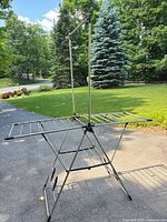 Full view of drying rack fully assembled showing wings and hanging rod