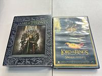 Front view of both media cases showing cover art