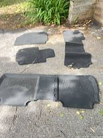 All four mats laid out: two front, one rear, one cargo