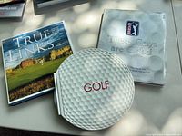 Front covers of True Links, These Guys Are Good, and circular GOLF pouch book