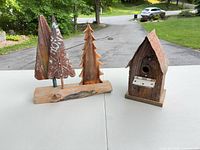 Overall view of birdhouse and tree sculpture