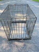 Perspective view of entire wire dog crate with door closed
