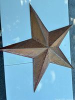 full view of metal wall star on white background