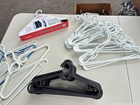 Group of plastic hangers with boxed vacuum storage bag