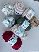 Group shot of all yarn skeins and rope coil