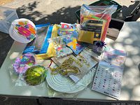Overview of all packaged party supplies on table