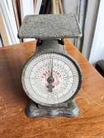 Front view of Precision postal scale showing dial and platform