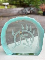 Front view showing etched motif and beveled rim