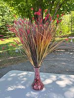 Full view of vase with artificial stems