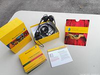 Full set laid out: box, headset, CD case, manual