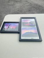 Overview showing both framed pieces on tabletop