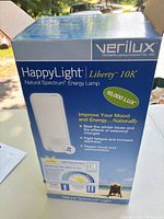 Front of retail box displaying Verilux HappyLight Liberty 10K branding and specifications