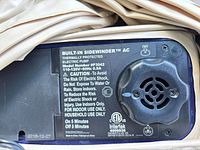Close-up of built-in Sidewinder AC pump showing model #P3042 and specs