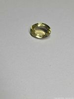 Top view of oval lemon citrine on white background