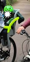 Seat installed on bicycle with child for scale
