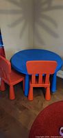Table and two chairs assembled in corner