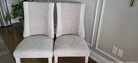 Front view of both chairs showing upholstery, backs, and seats