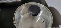 Glass lid top view showing Tefal knob and vent