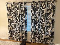 Full view of two curtain panels hanging on window