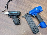 Overall view of stapler and soldering iron