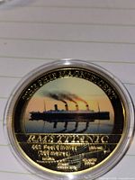 Obverse showing coloured Titanic image with inscriptions