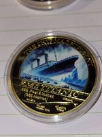 Obverse showing enamelled Titanic image and specifications
