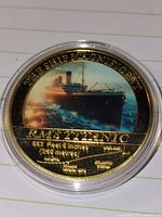 Obverse showing enamel Titanic image and inscriptions