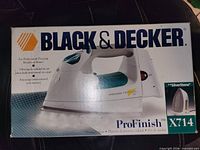 Front of box showing Black & Decker ProFinish X714 steam iron
