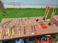 Full lot laid out on table showing winders, jigging sticks, clamps, metal accessory